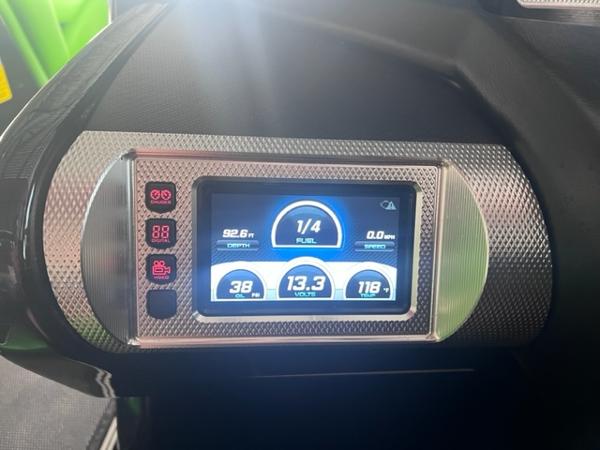 Slide: The Image of 2013 MasterCraft XStar dashboard display showing fuel, speed, and voltage levels. - 21
