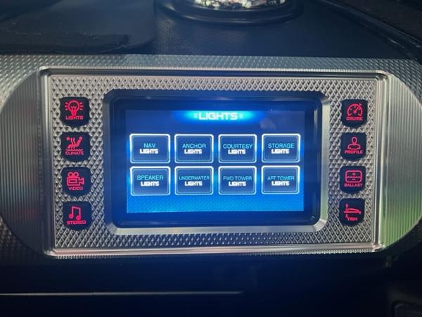 Slide: The Image of 2013 MasterCraft XStar control panel with touchscreen for lights and other functions. - 23