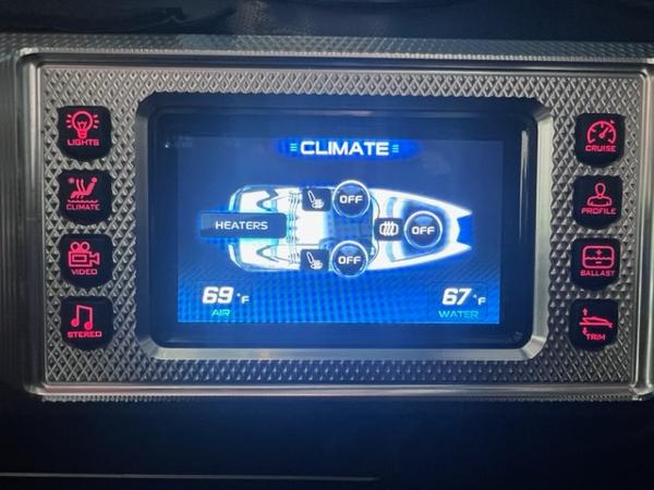Slide: The Image of MasterCraft XStar 2013 boat climate control display showing air and water temperatures. - 24
