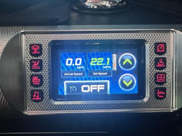 Slide: The Image of MasterCraft XStar 2013 boat dashboard display showing speed and control settings. - 26