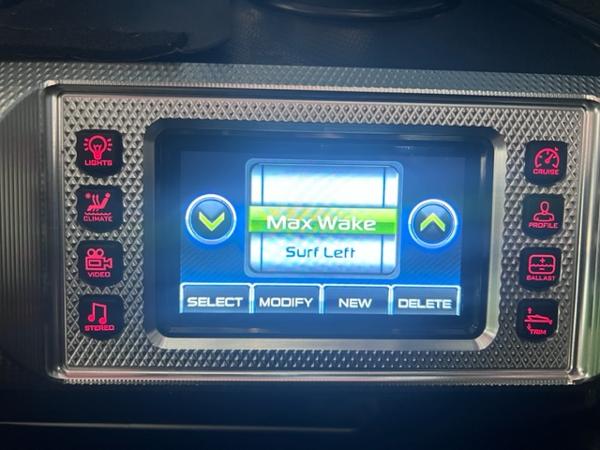 Slide: The Image of MasterCraft XStar 2013 boat control panel displaying Max Wake and Surf Left settings. - 27