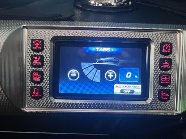 Slide: The Image of 2013 MasterCraft XStar control panel with touchscreen and various function buttons. - 29