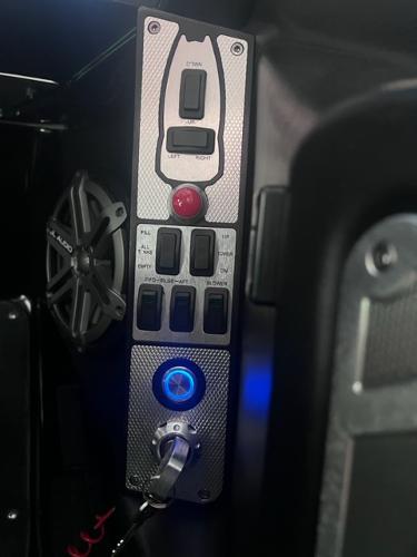 Slide: The Image of Control panel of a 2013 MasterCraft XStar boat with illuminated switches and speaker. - 30