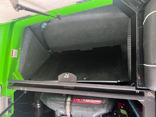 Slide: The Image of 2013 MasterCraft XStar engine compartment with green exterior. - 40