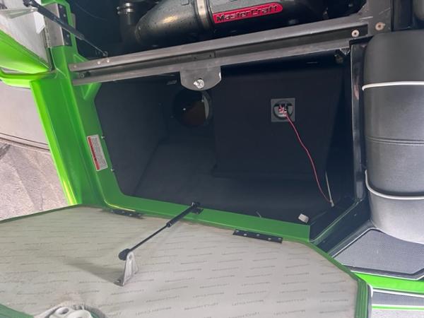 Slide: The Image of Open storage compartment of a 2013 MasterCraft XStar boat with visible wiring. - 41
