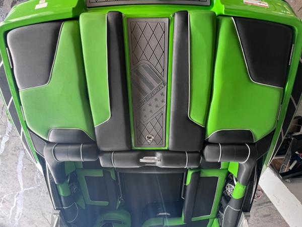 Slide: The Image of 2013 MasterCraft XStar green and black boat interior with diamond-patterned center panel. - 42