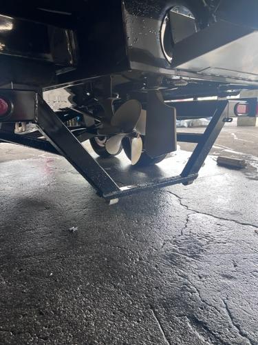 Slide: The Image of Close-up of the propeller and undercarriage of a 2013 MasterCraft XStar boat. - 49