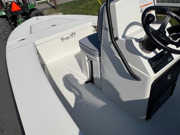 Slide: The Image of 2024 Maverick 18 HPX-V boat interior with steering console and seating. - 11