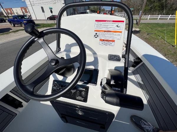 Slide: The Image of 2024 Maverick 18 HPX-V boat console with steering wheel and controls. - 15