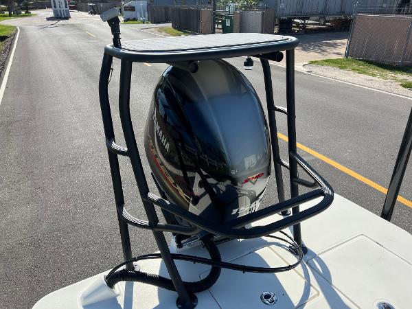Slide: The Image of 2024 Maverick 18 HPX-V boat with Yamaha outboard motor on a trailer. - 16