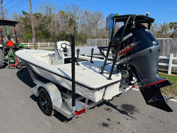 Slide: The Image of 2024 Maverick 18 HPX-V boat with Yamaha outboard motor on trailer. - 2