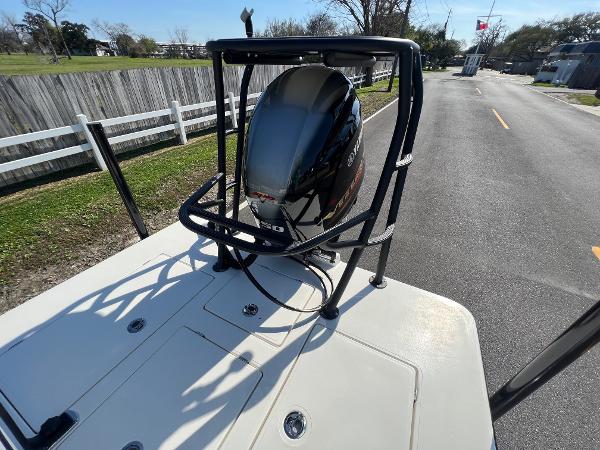 Slide: The Image of 2024 Maverick 18 HPX-V boat with Yamaha outboard motor on a sunny day. - 7