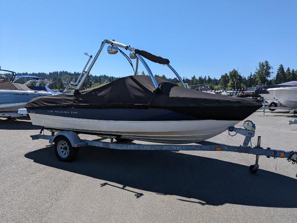 Slide: The Image of 2007 Maxum 1800 SR3 boat on trailer, covered, parked outdoors. - 1