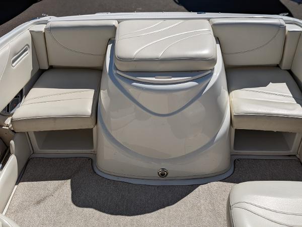Slide: The Image of 2007 Maxum 1800 SR3 boat interior with beige seating and carpeted flooring. - 11
