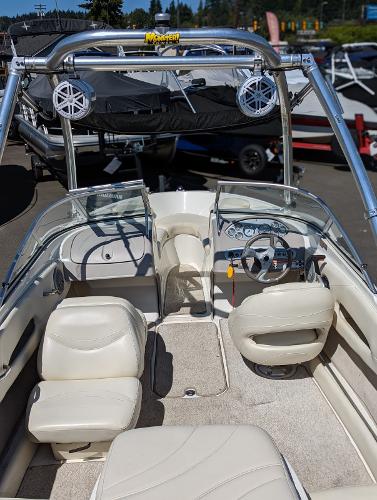 Slide: The Image of 2007 Maxum 1800 SR3 boat interior with white seating and steering wheel. - 8