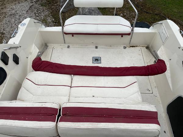 Slide: The Image of 1992 Maxum 2300 SCR boat interior with white and red seating. - 2