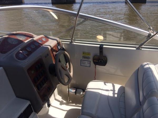 Slide: The Image of Maxum 2400 SCR 2000 boat cockpit with steering wheel and control panel. - 5
