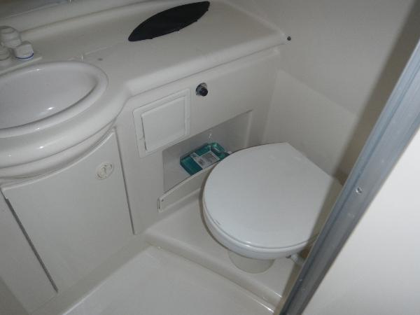 Slide: The Image of 2001 Maxum 2500 SCR boat bathroom with sink and toilet. - 6