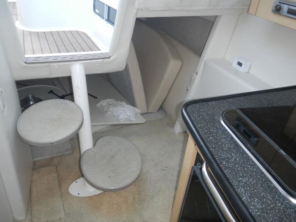 Slide: The Image of Interior of 2001 Maxum 2500 SCR boat with steps and kitchenette. - 8