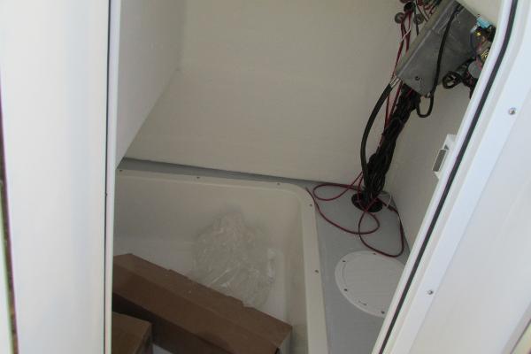 Slide: The Image of Interior view of 2023 May-Craft 20 Cape Classic boat with wiring and storage area. - 13