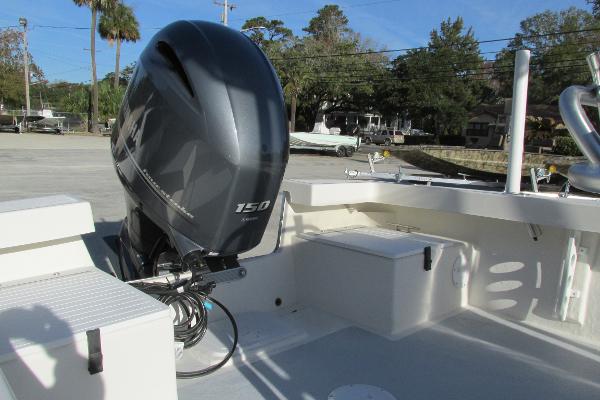 Slide: The Image of 2023 May-Craft 20 Cape Classic boat with 150 HP outboard motor, docked outdoors. - 7