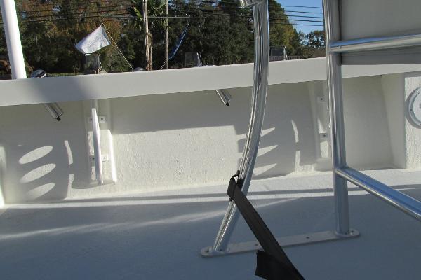 Slide: The Image of 2023 May-Craft 20 Cape Classic boat interior with metal railing and white deck. - 9