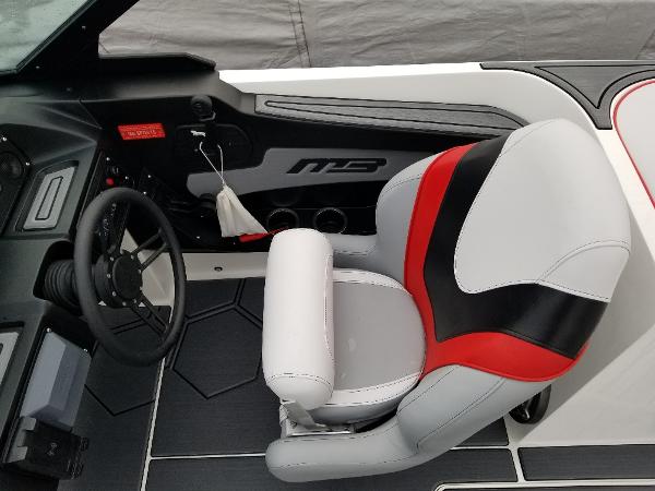 Slide: The Image of 2022 MB B52-23 boat interior with steering wheel and captain's chair. - 10