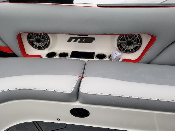 Slide: The Image of 2022 MB B52-23 boat interior with speakers and seating - 13
