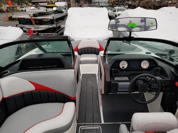 Slide: The Image of 2022 MB B52-23 boat interior with modern dashboard and seating. - 15