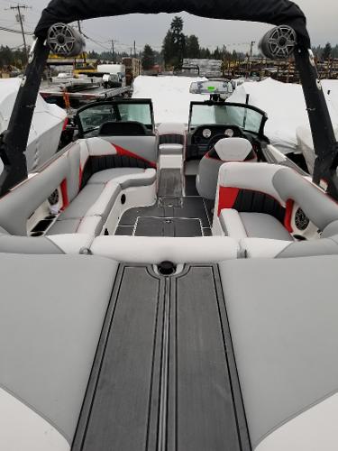 Slide: The Image of 2022 MB B52-23 boat interior with gray and red seating. - 20