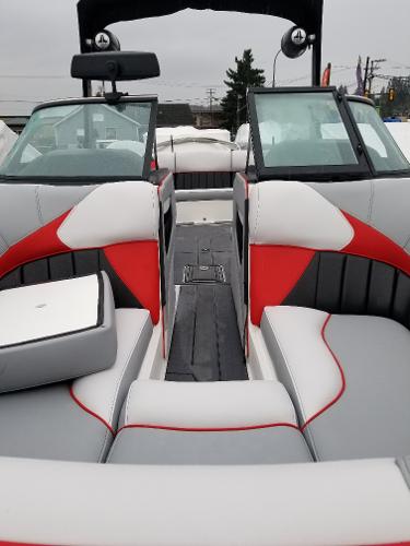 Slide: The Image of 2022 MB B52-23 boat interior with red, white, and gray seating. - 21