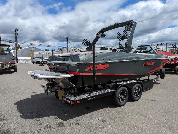 Slide: The Image of 2022 MB B52-23 boat on a trailer in a parking lot. - 3