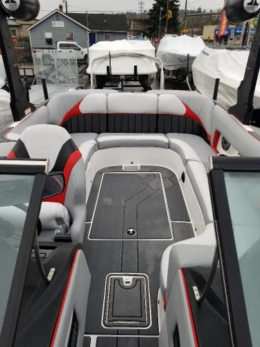 Slide: The Image of 2022 MB B52-23 boat interior with seating and deck view. - 7