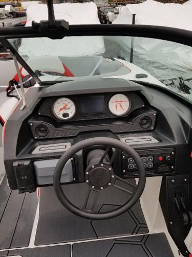 Slide: The Image of 2022 MB B52-23 boat dashboard with steering wheel and gauges. - 9