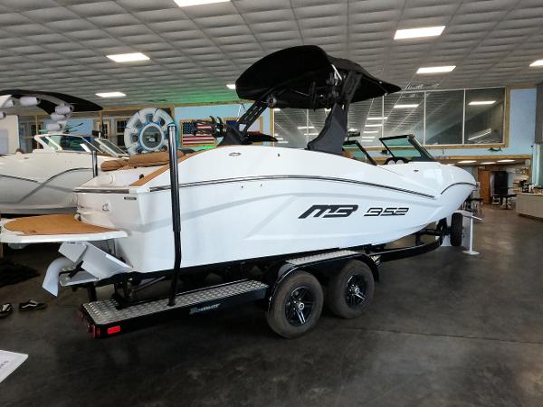 Slide: The Image of 2023 MB B52 Alpha boat on trailer in showroom. - 1