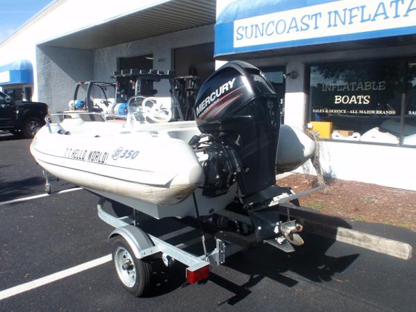 Slide: The Image of 2014 Mercury Amanzi 350 inflatable boat on trailer outside Suncoast Inflatable Boats store. - 5