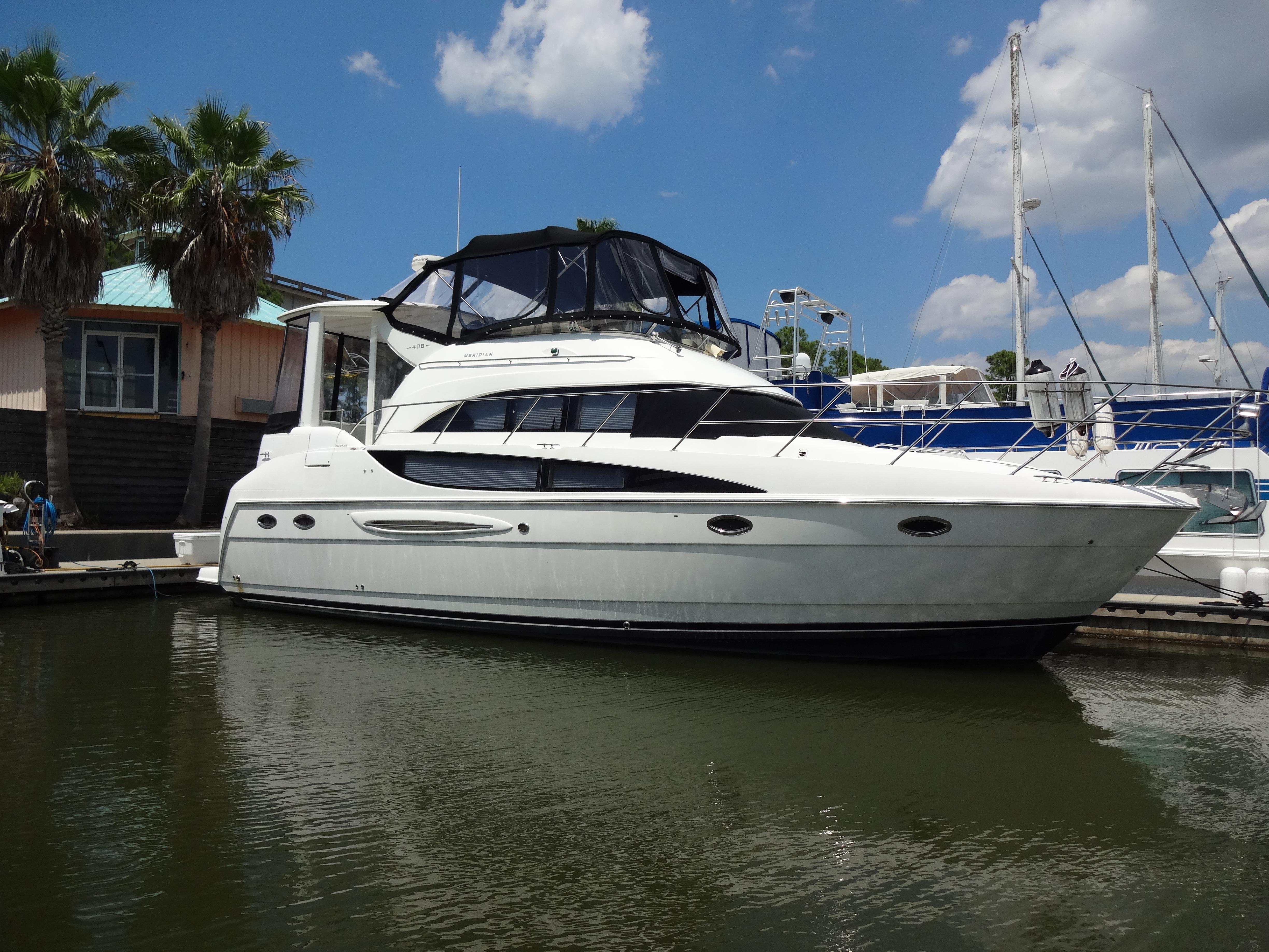 Slide: The Image of 2004 Meridian 408 Motoryacht docked at marina on a sunny day. - 12