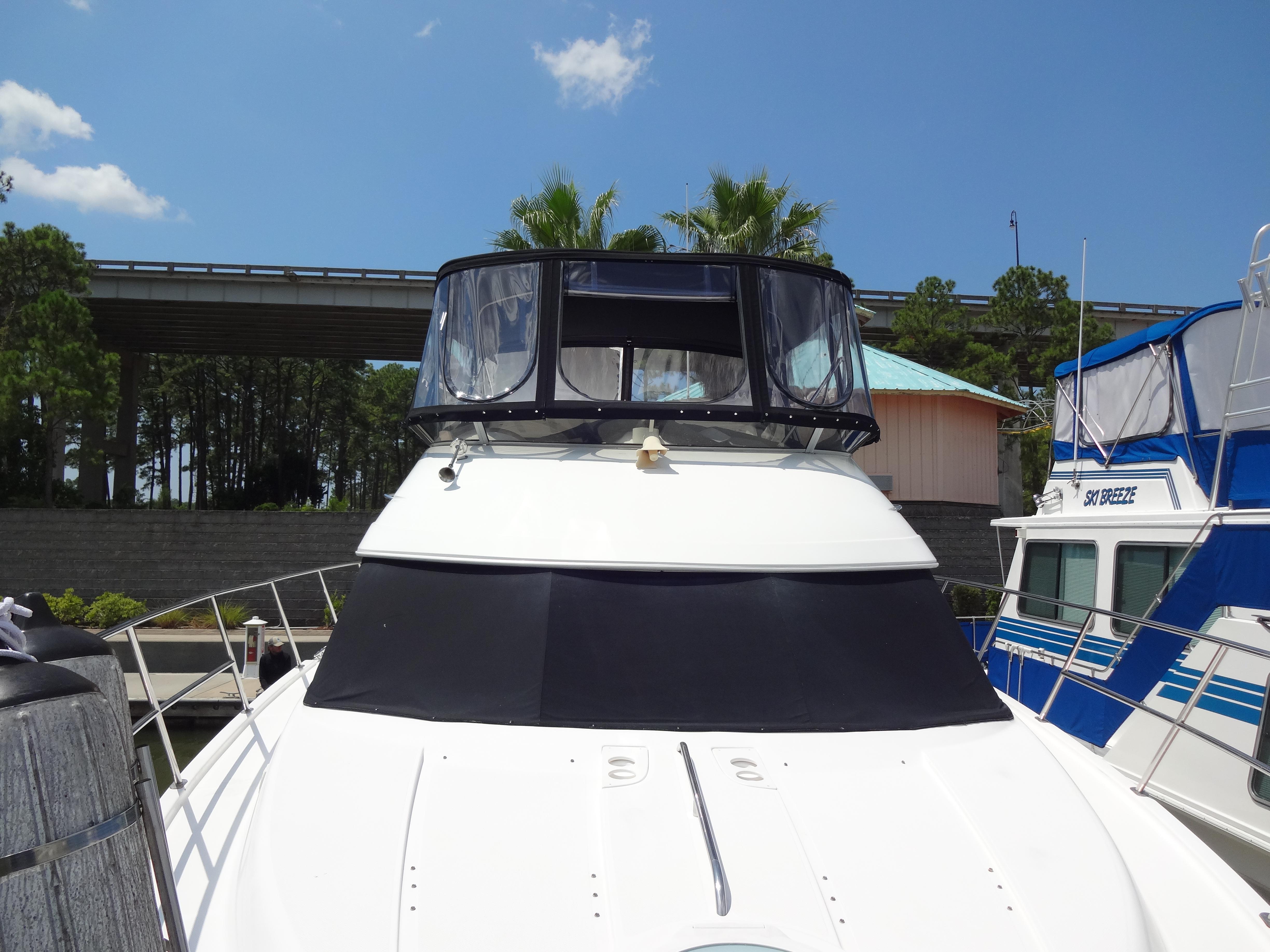 Slide: The Image of 2004 Meridian 408 Motoryacht docked at marina under clear blue sky. - 15