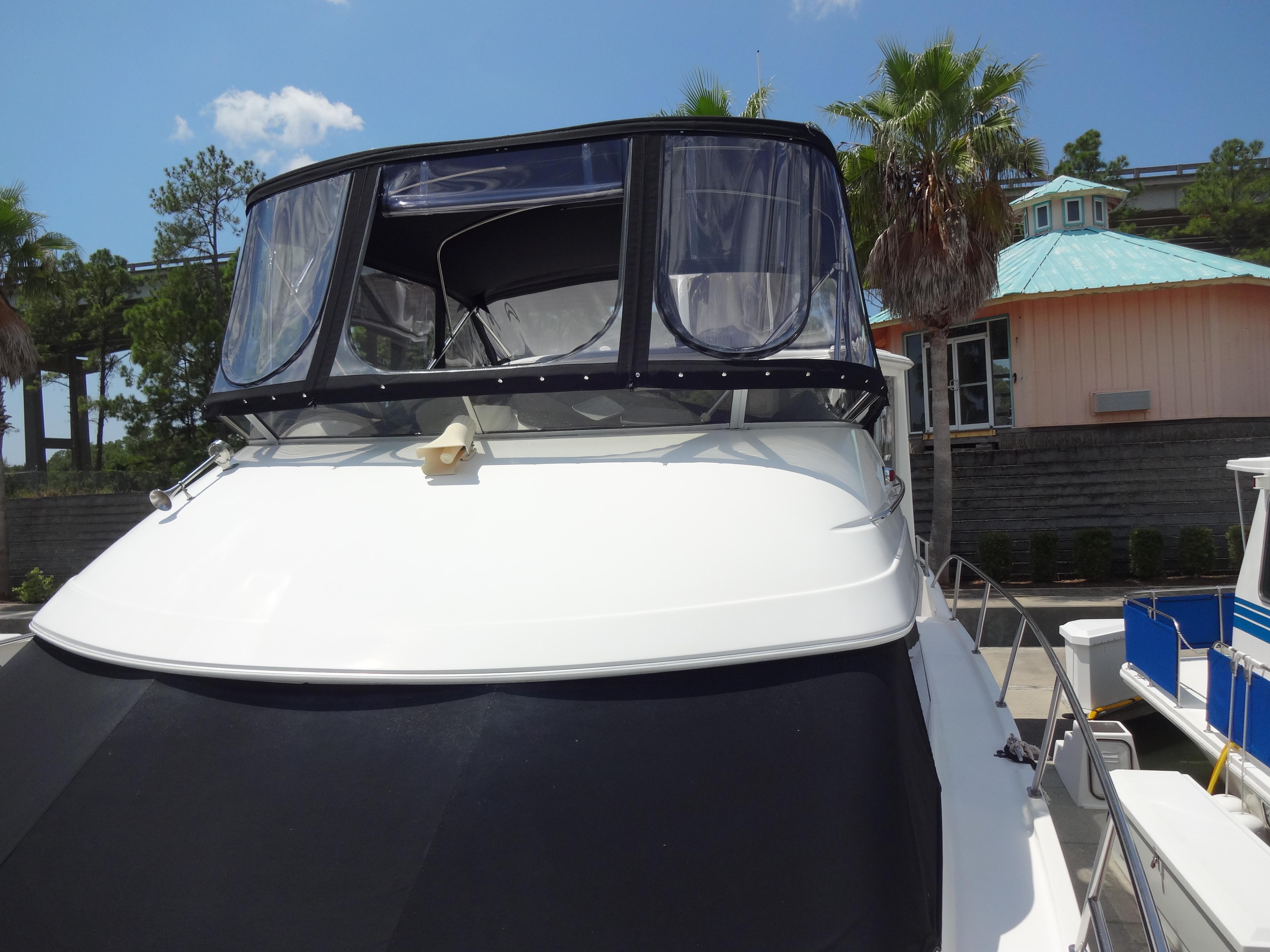 Slide: The Image of 2004 Meridian 408 Motoryacht docked at marina, front view. - 17