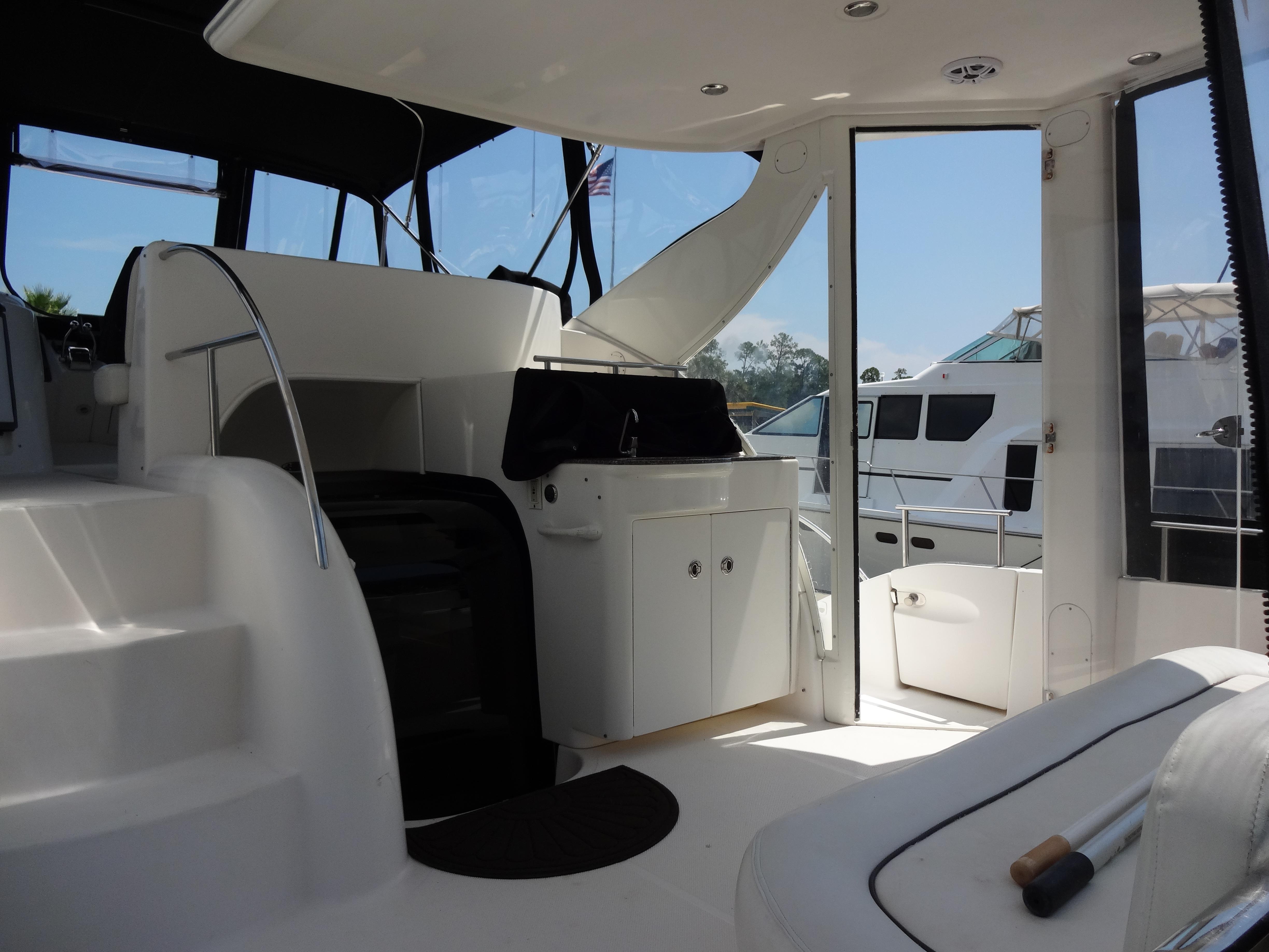 Slide: The Image of Interior view of 2004 Meridian 408 Motoryacht with white seating and steps. - 20