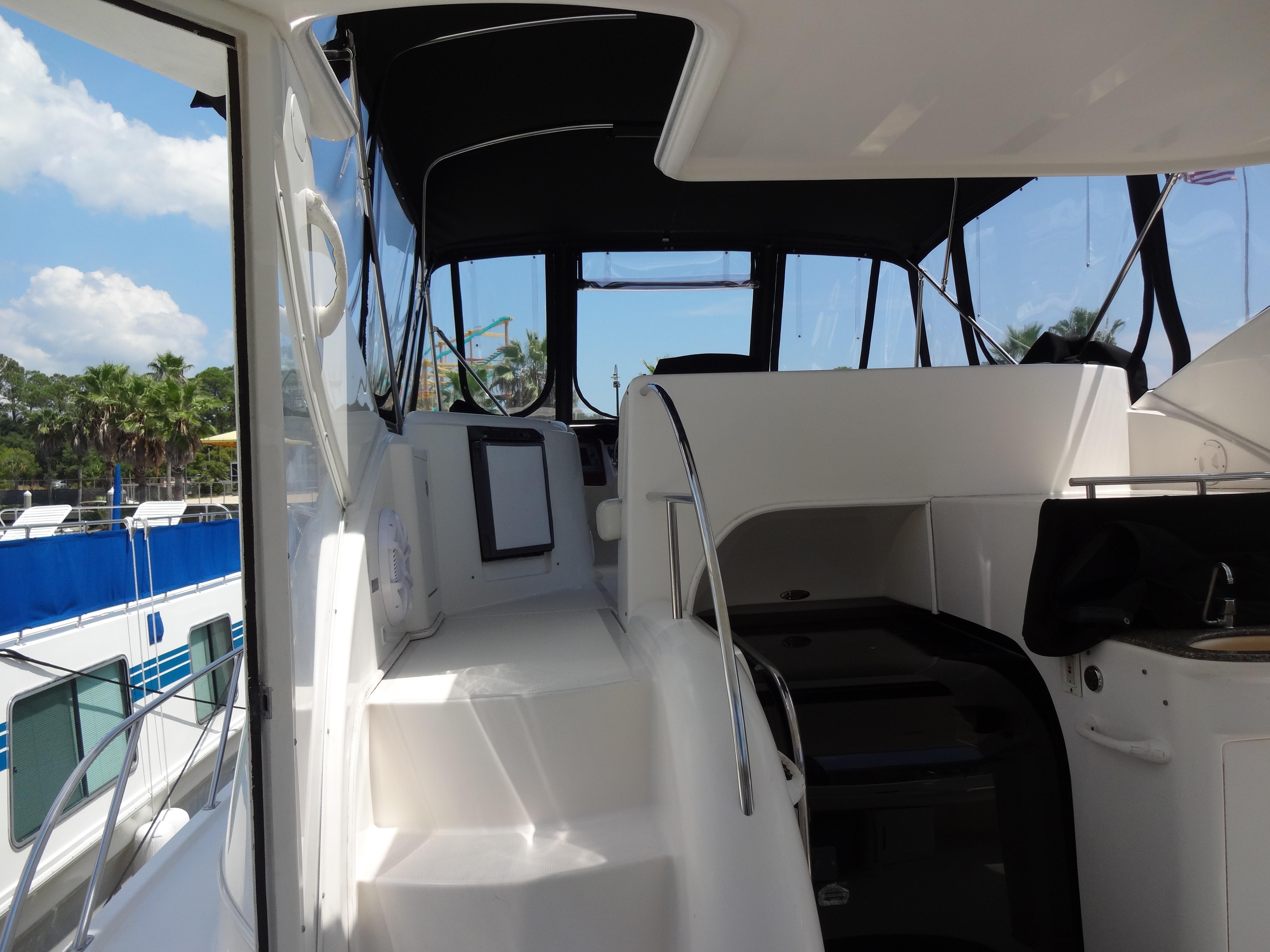 Slide: The Image of 2004 Meridian 408 Motoryacht interior with helm and seating area. - 21