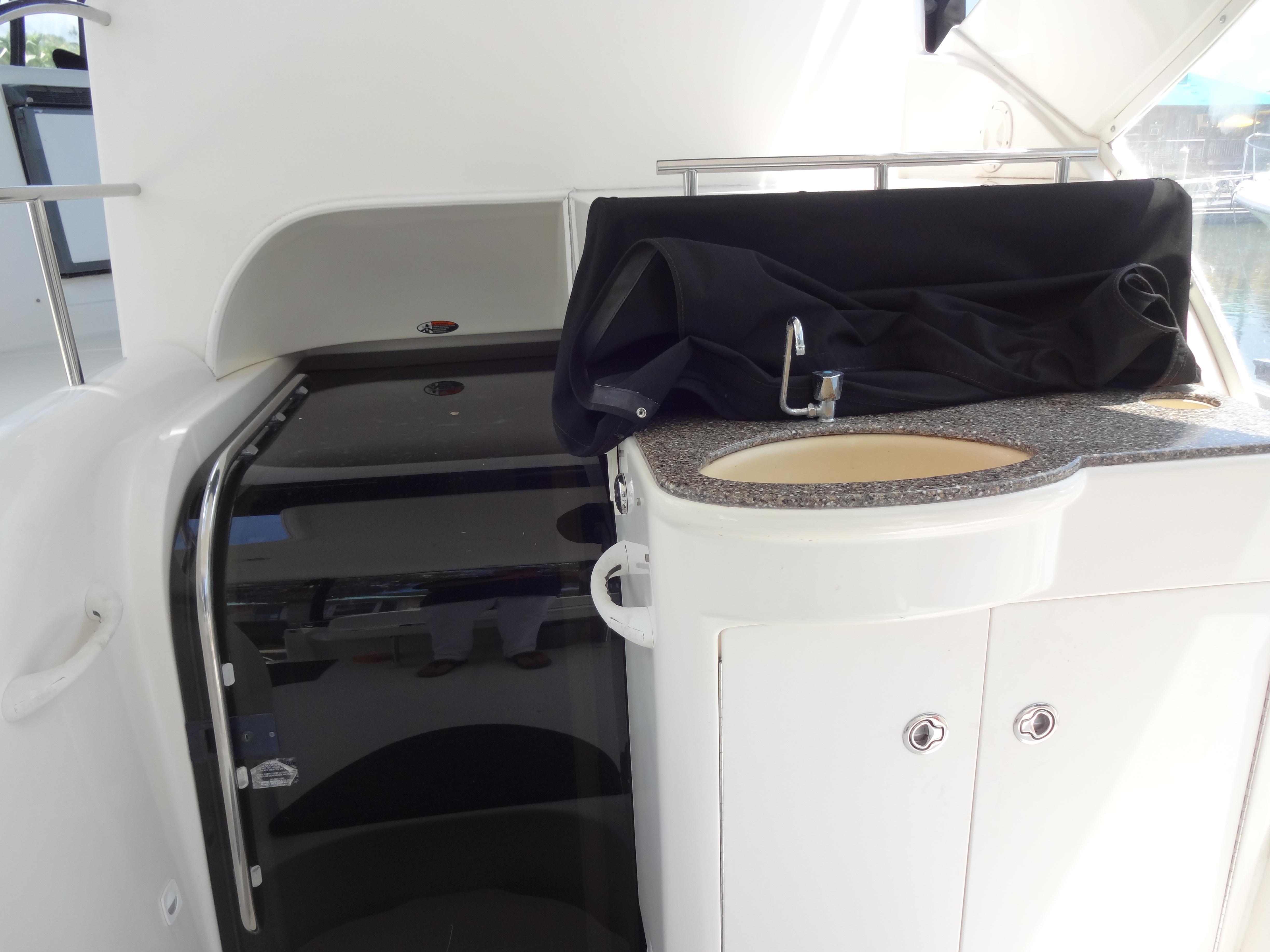 Slide: The Image of 2004 Meridian 408 Motoryacht interior with sink and storage cabinet. - 22
