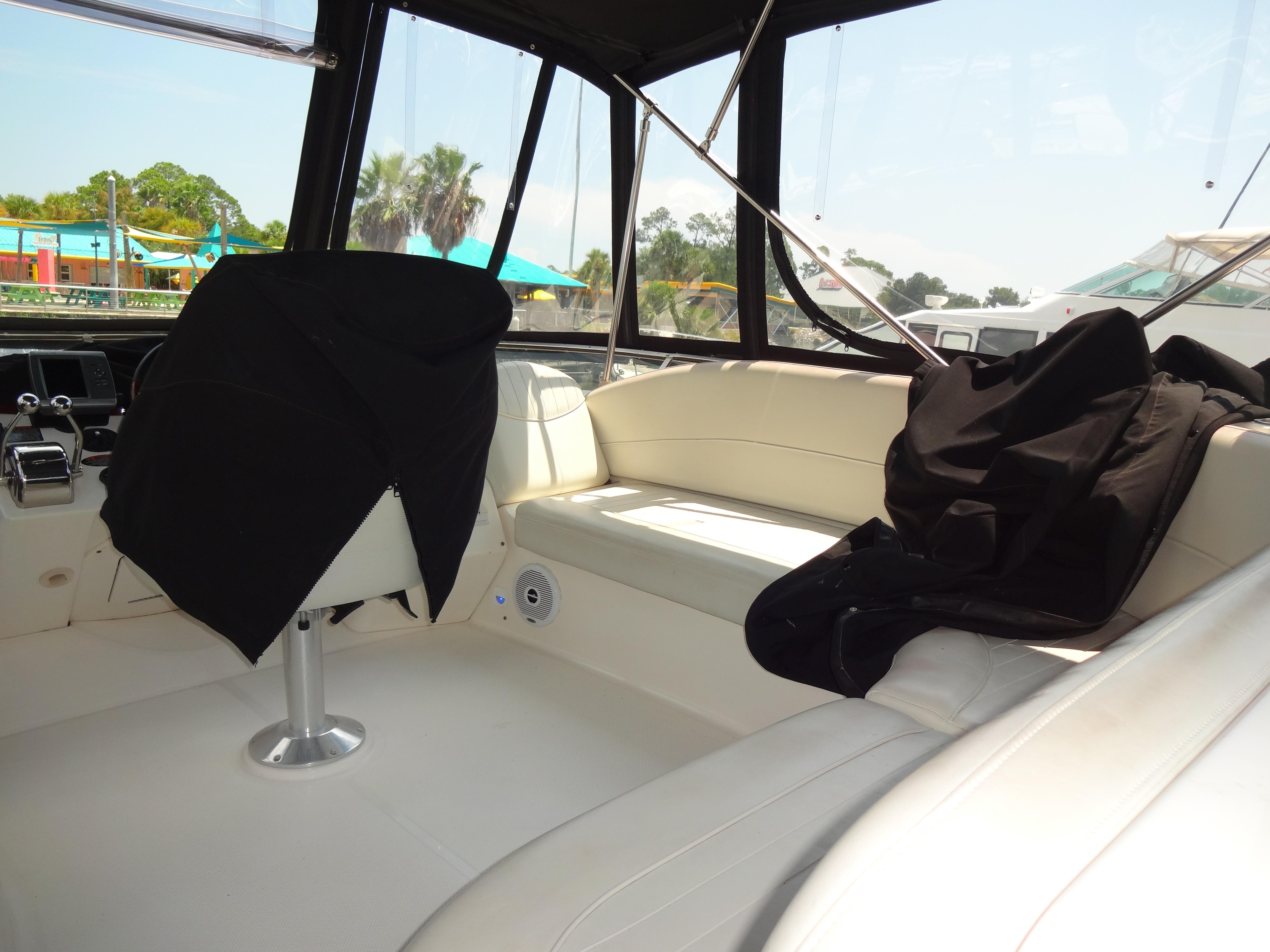 Slide: The Image of Interior of 2004 Meridian 408 Motoryacht with covered seats and helm station. - 24
