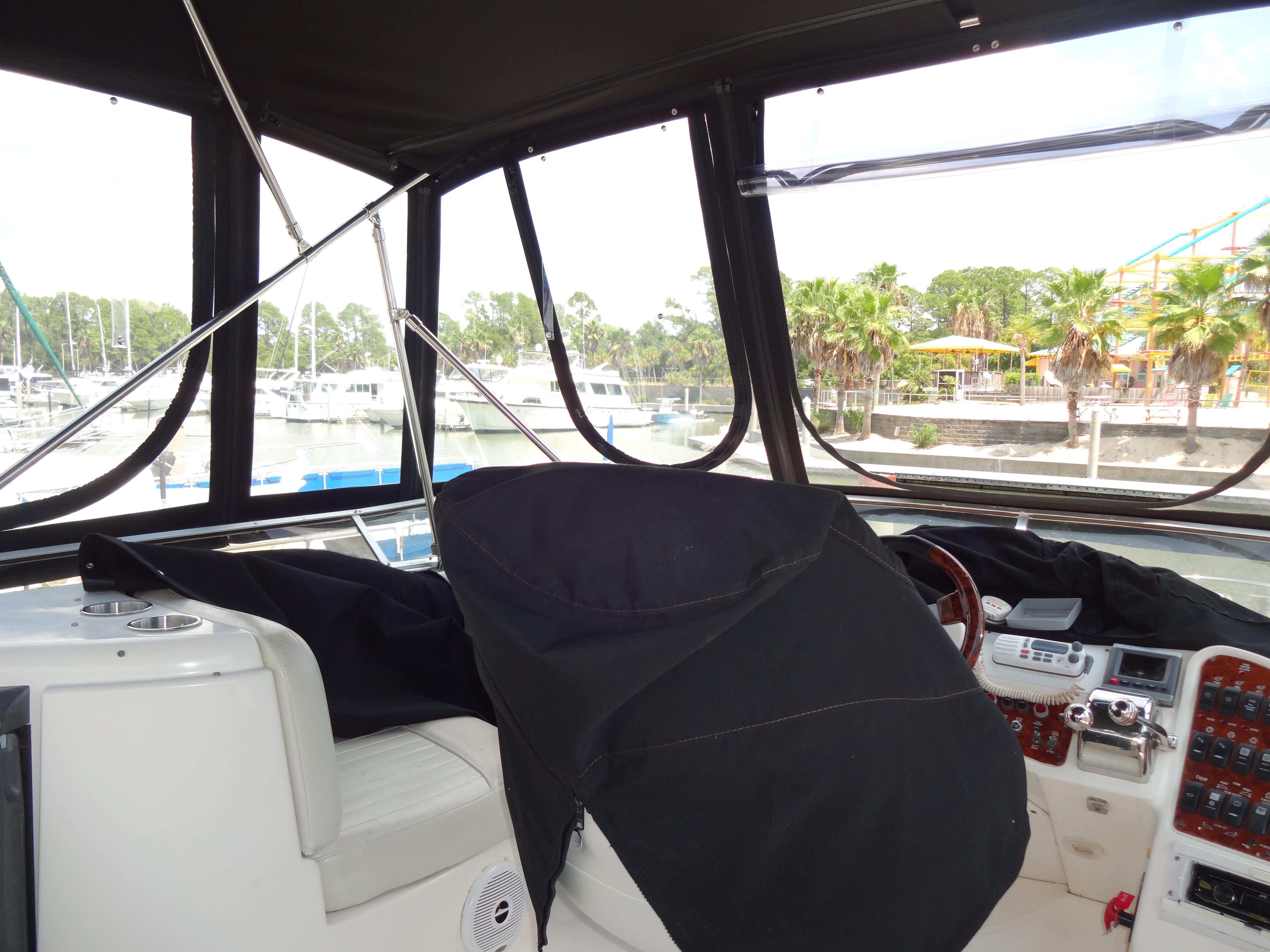 Slide: The Image of Interior view of 2004 Meridian 408 Motoryacht helm station at marina. - 25