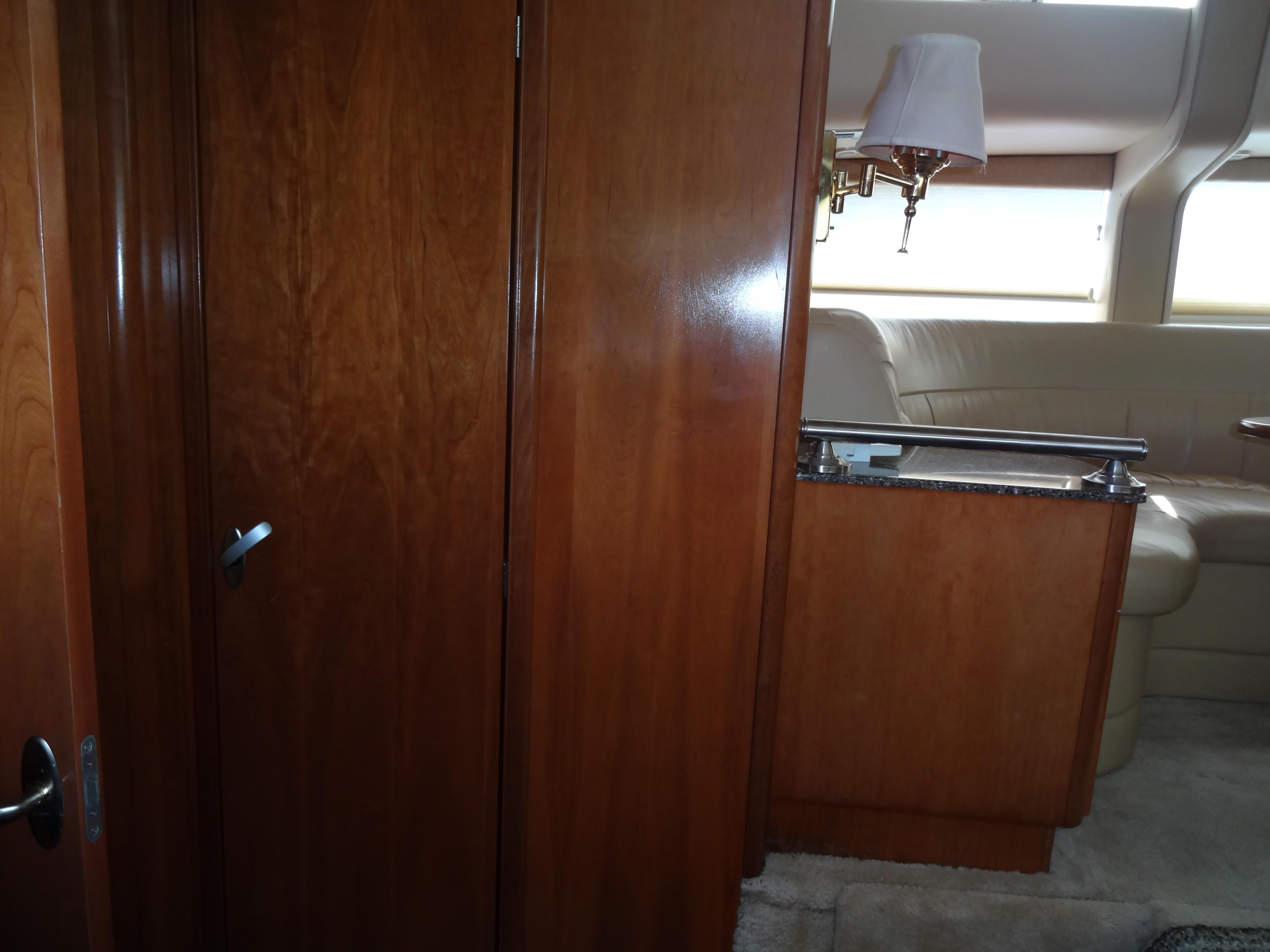 Slide: The Image of Interior of 2004 Meridian 408 Motoryacht with wooden cabinetry and beige seating. - 38