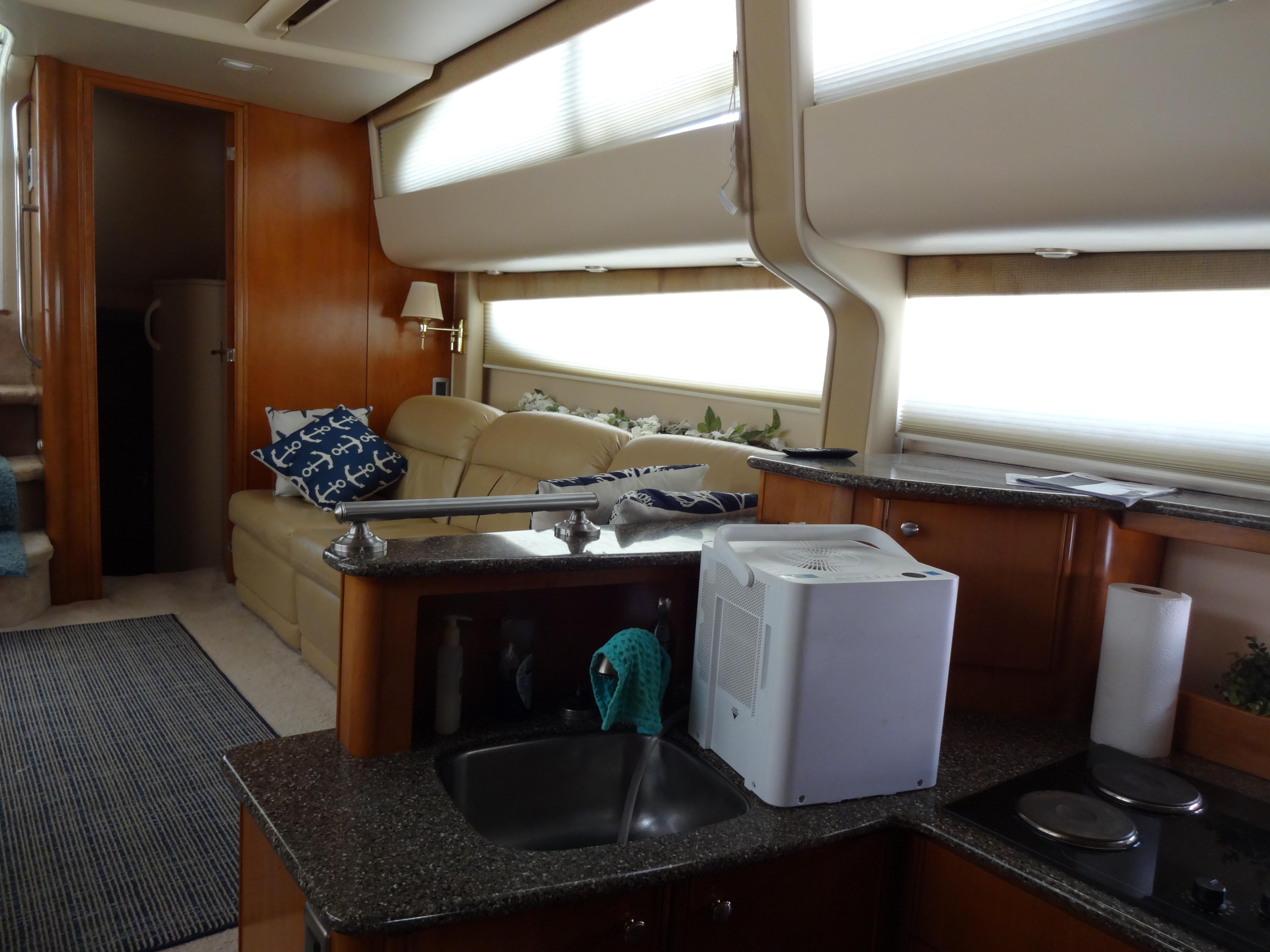 Slide: The Image of Interior of 2004 Meridian 408 Motoryacht with kitchen and seating area. - 41