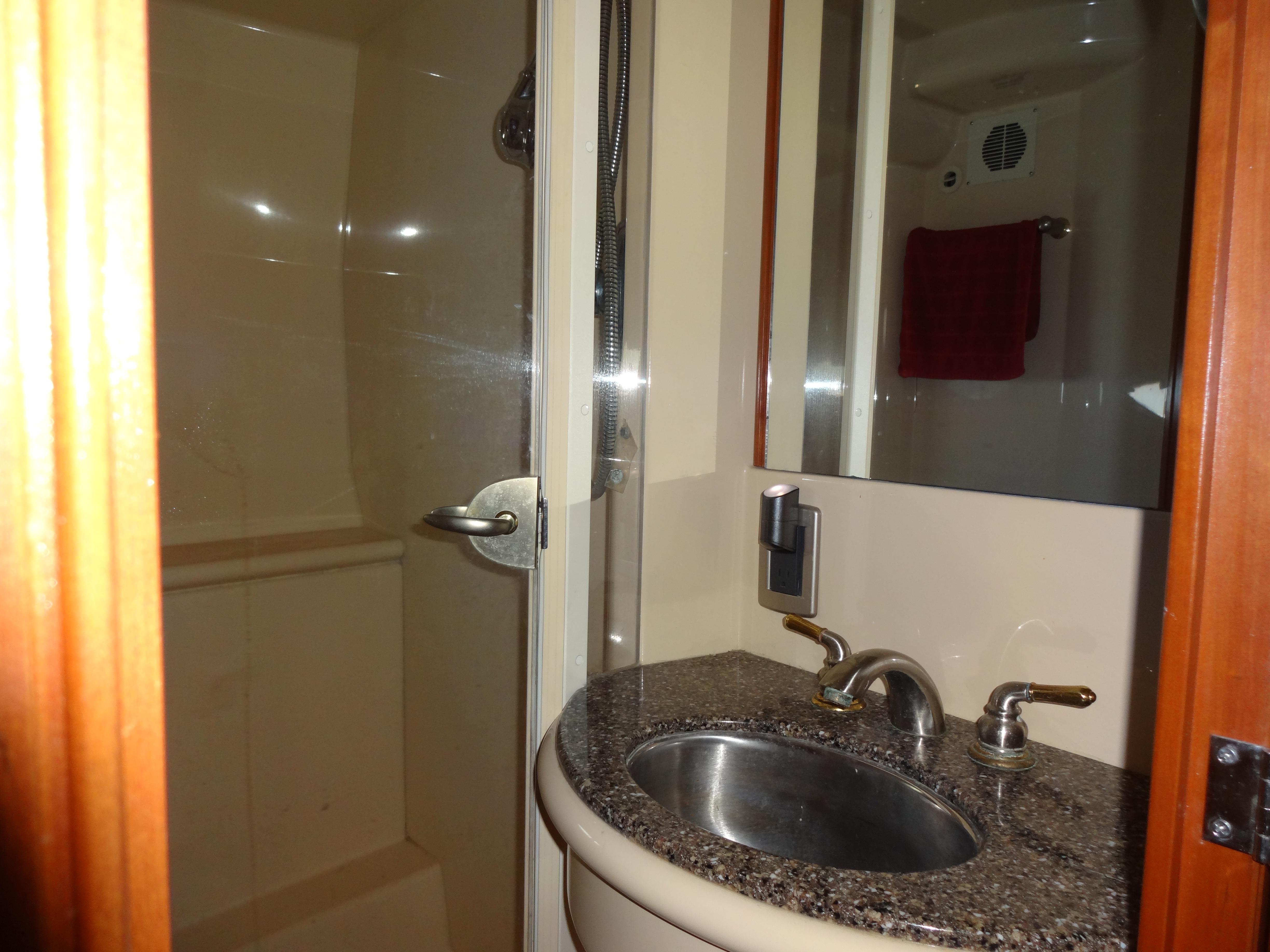 Slide: The Image of 2004 Meridian 408 Motoryacht bathroom with sink and shower. - 43