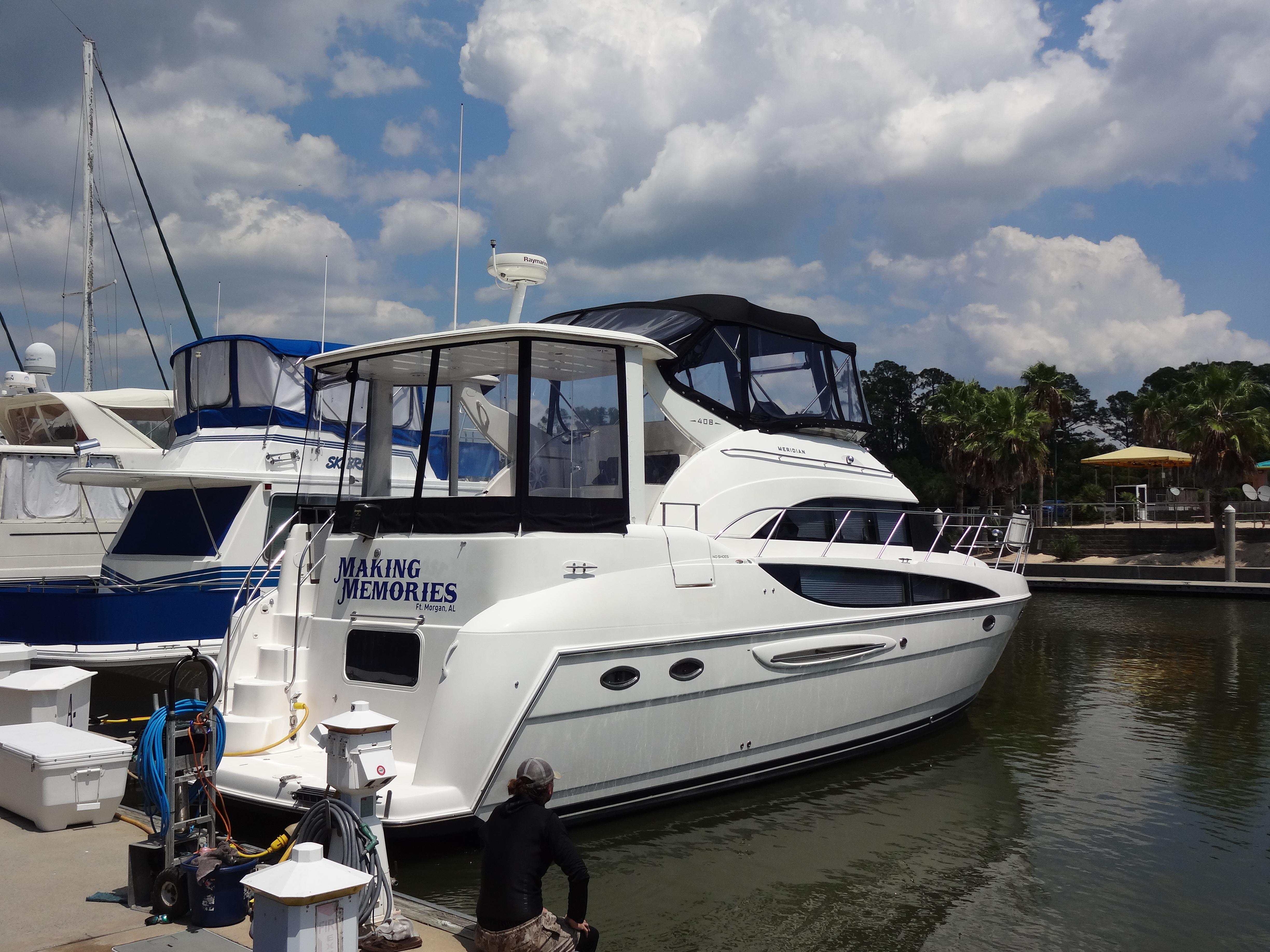 Slide: The Image of 2004 Meridian 408 Motoryacht docked at a marina under a partly cloudy sky. - 6