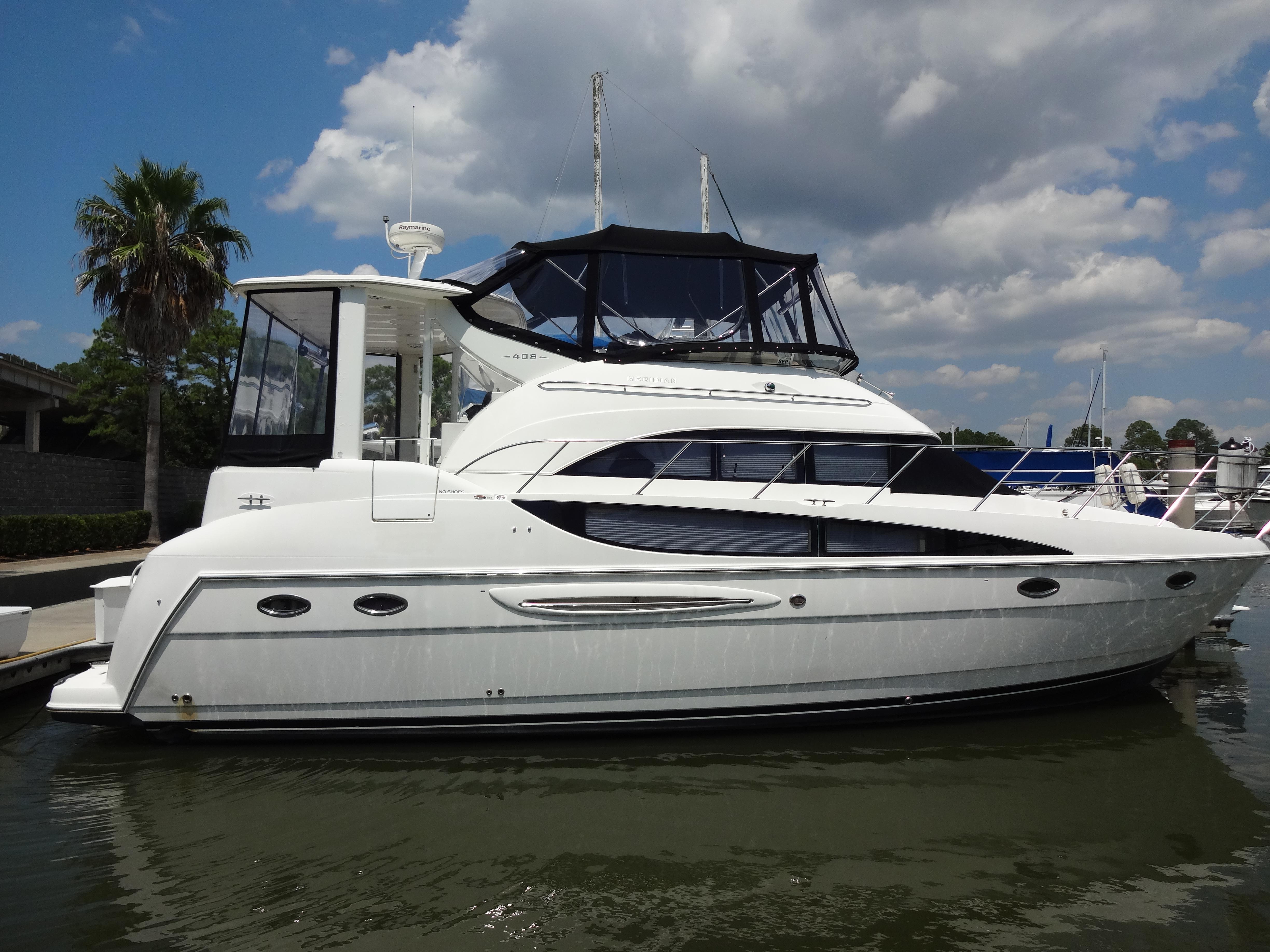 Slide: The Image of 2004 Meridian 408 Motoryacht docked on a sunny day. - 7