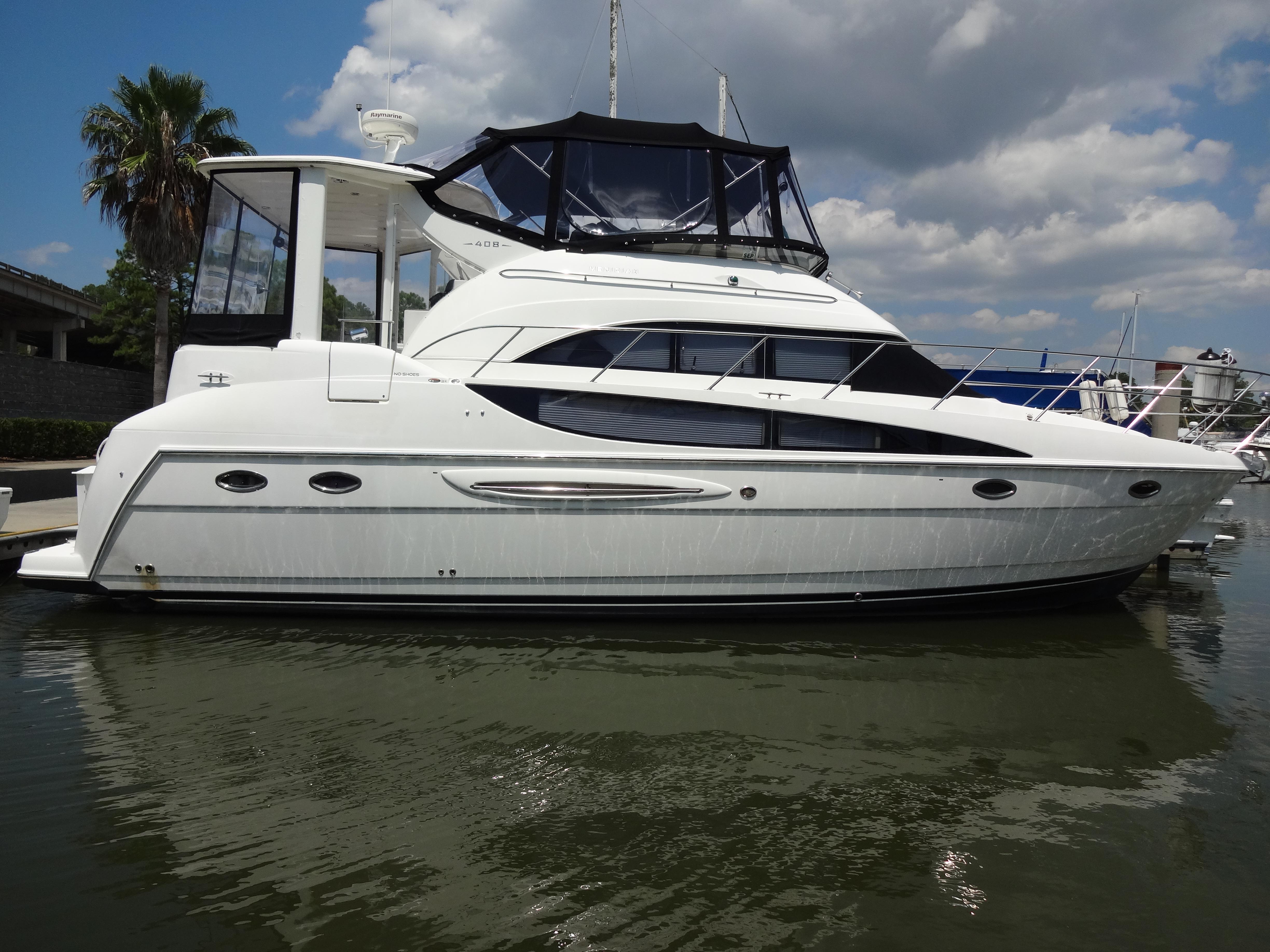Slide: The Image of 2004 Meridian 408 Motoryacht docked at marina. - 9